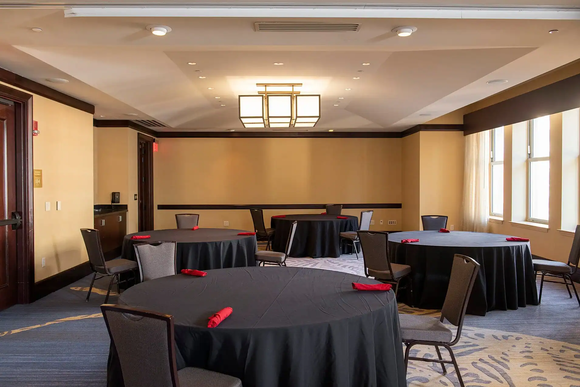 Interior of Lancaster County Convention Center with round tables and chairs.