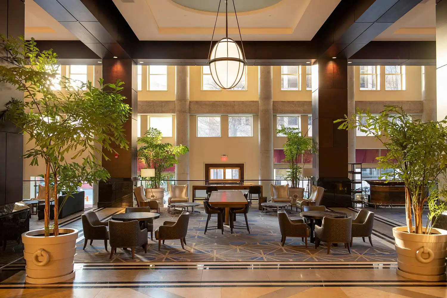 Spacious lobby of Lancaster County Convention Center with seating and greenery.